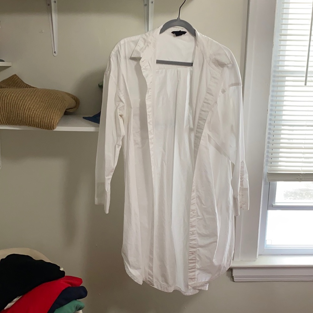 White oversized button up blouse.